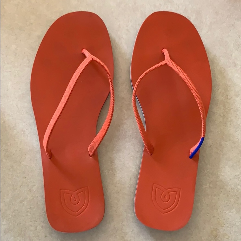 Rothy’s flip flops in tiger.